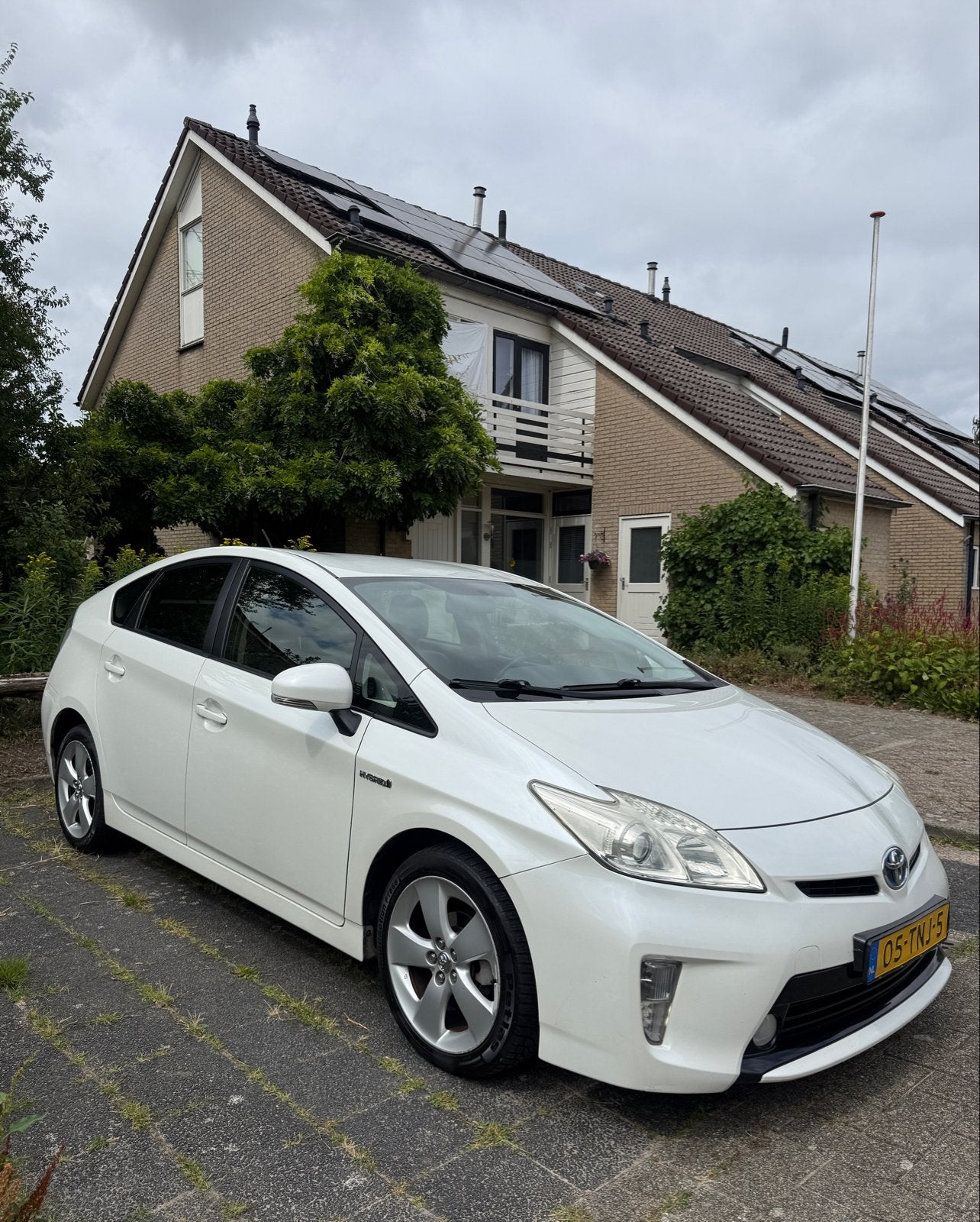 Toyota Prius 1.8 Full Hybrid 136PK Aut 2012 Wit, Auto's, Euro 5, 4 cilinders, Leder en Stof, Wit