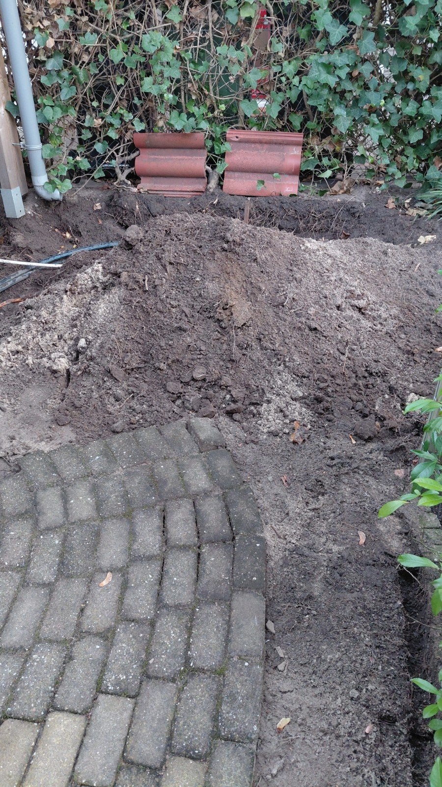 zwarte grond 0.5m3
kruiwagen aanwezig, Ophalen, Overige typen
