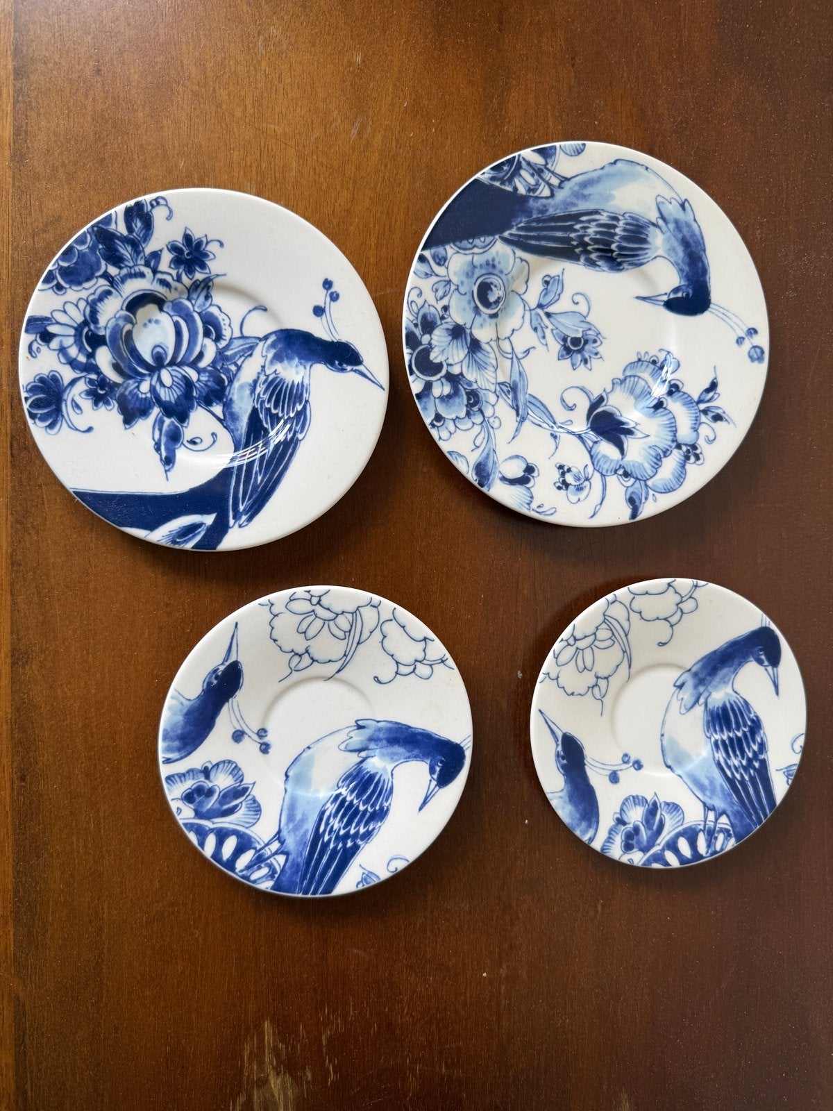 Set van 4 Royal Delft 1653 schoteltjes met vogelmotief, Ophalen