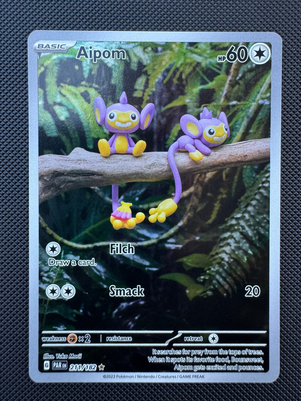 Aipom 211/182 NM Paradox Rift, Hobby en Vrije tijd, Verzamelkaartspellen | Pokémon, Ophalen of Verzenden, Zo goed als nieuw