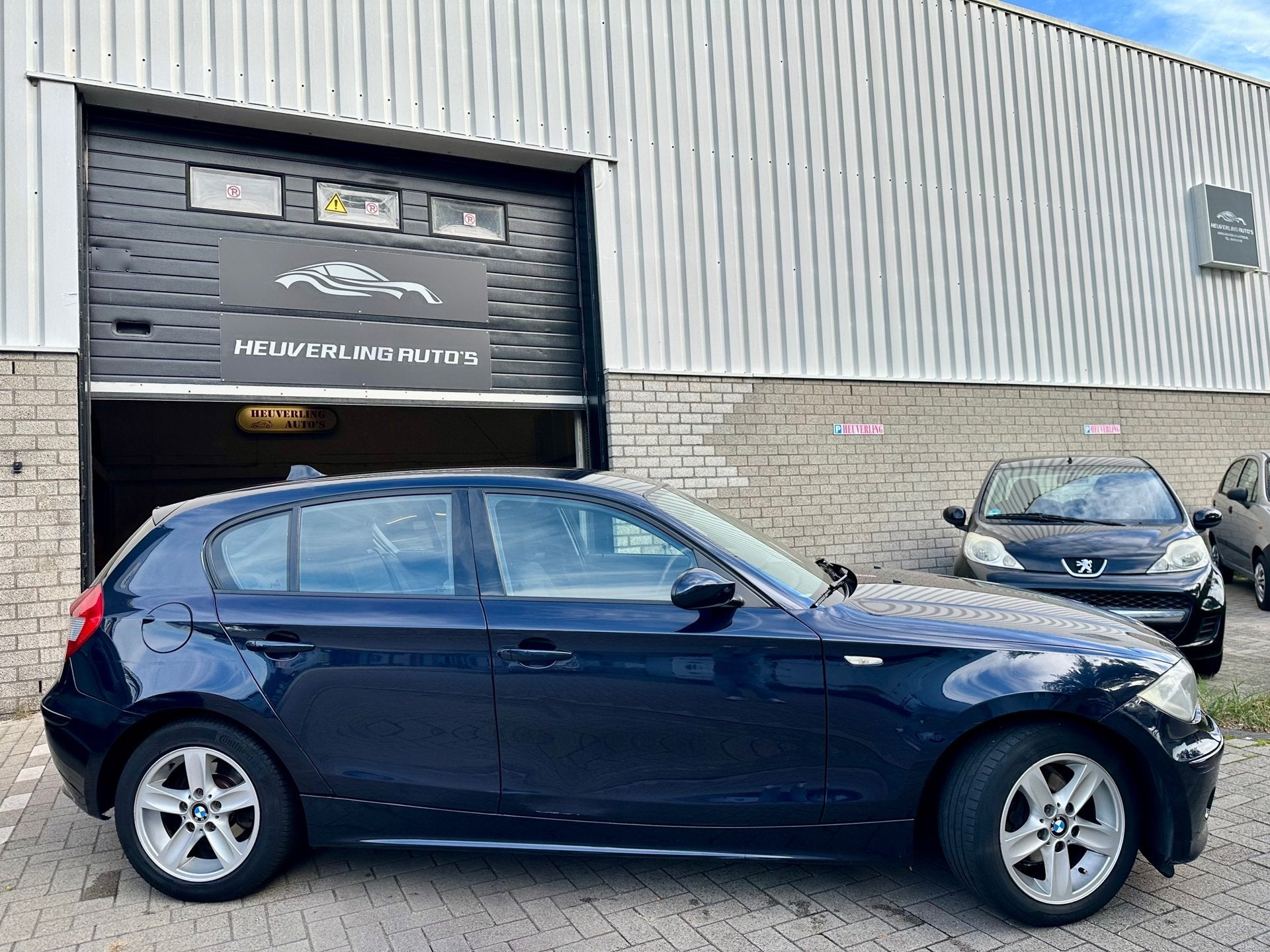BMW 1-serie 116i | Airco | Stoelverwarming | 5 DRS, Auto's, 1596 cc, Gebruikt, Zwart, 4 cilinders