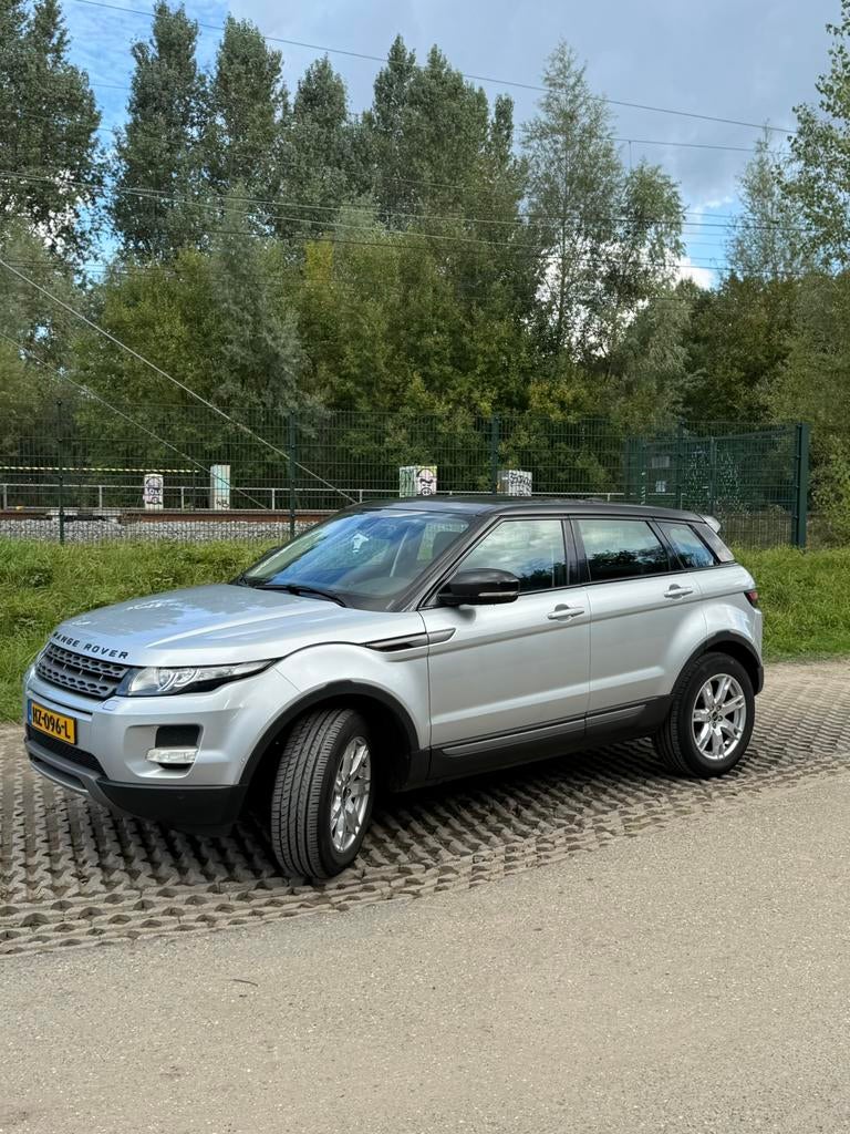Land Rover Range Rover Evoque SI4 4WD AUT 2012 Grijs, Auto's, Automaat, Euro 5, 1800 kg, Particulier