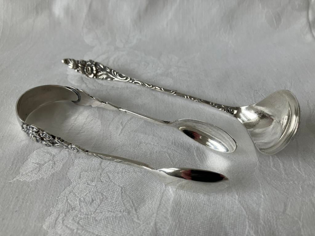 Zilveren suikerklontjestang en melklepel, Antiek en Kunst, Verzenden, Zilver