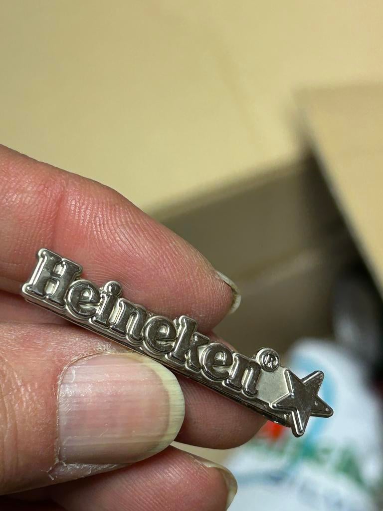 Heineken dasspeld, Ophalen, Zo goed als nieuw