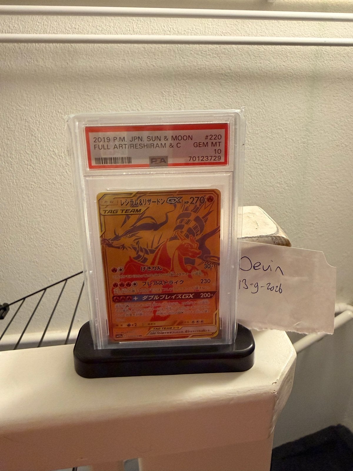 PSA 10 Reshiram & Charizard GX UR Tag Team GX All Stars, Hobby en Vrije tijd, Ophalen of Verzenden, Zo goed als nieuw, Losse kaart
