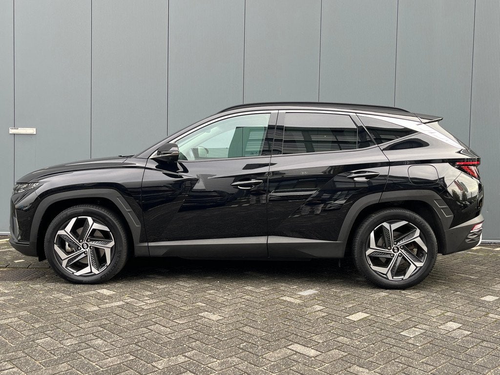 Hyundai Tucson 1.6 T-GDI 265pk PHEV Premium 4WD, Gebruikt, 4 cilinders, Zwart, Bedrijf