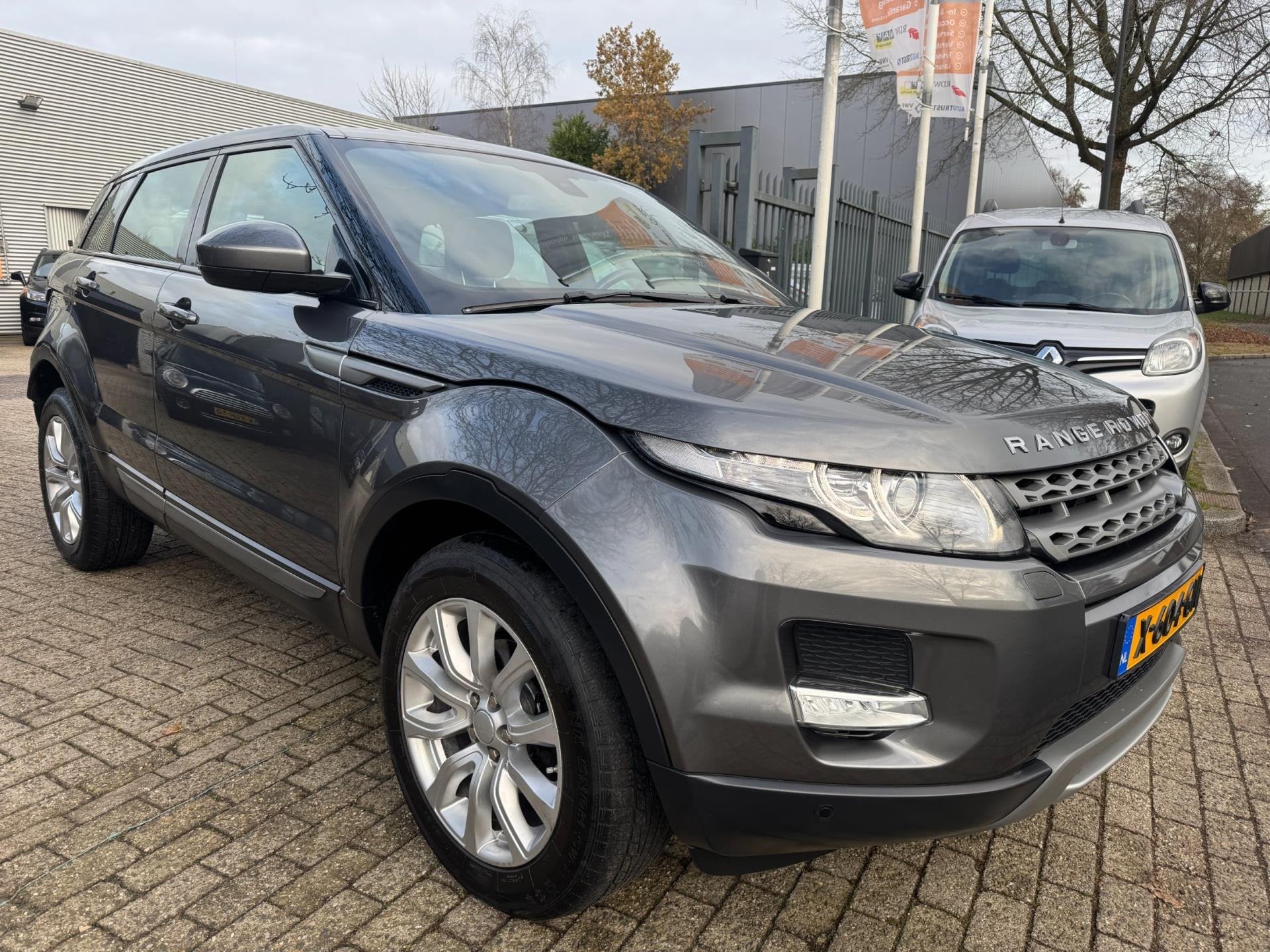 Land Rover Range Rover Evoque 2.0 Si 4WD Prestige Business E, Auto's, Automaat, Dealer onderhouden, 4 cilinders, Met garantie (alle)