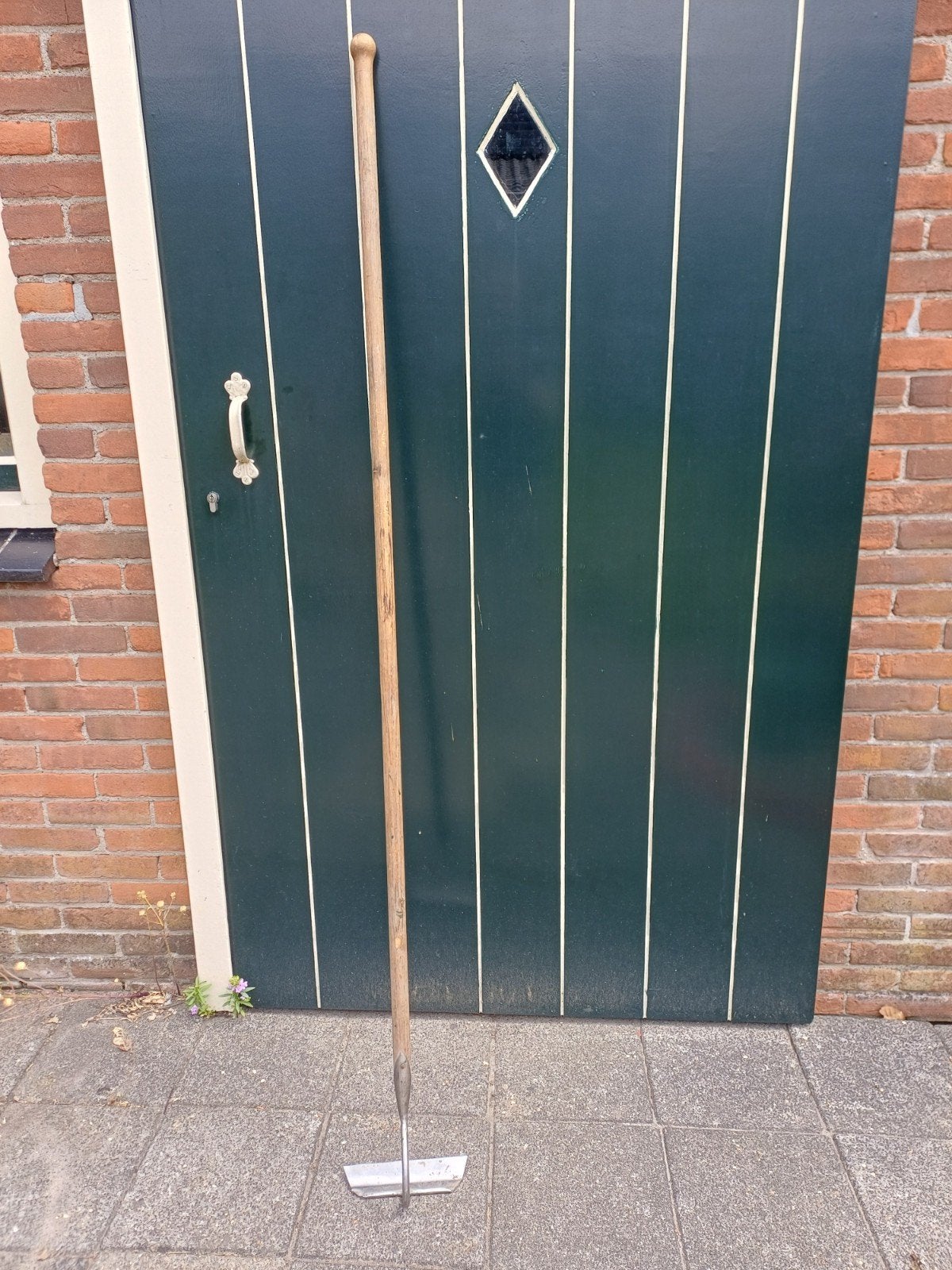 Schraper van Sneeboer.  Roestvrijstaal, Ophalen
