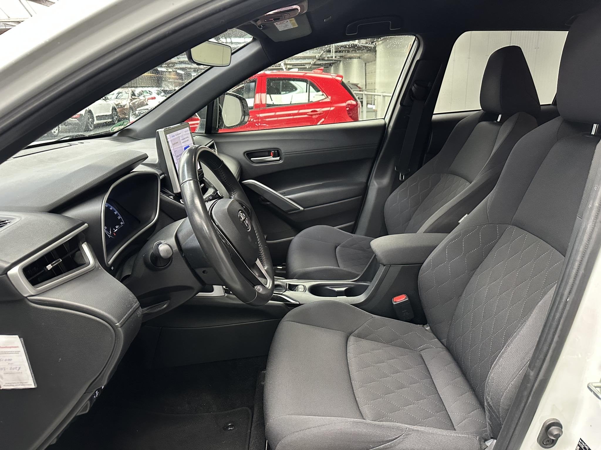 Toyota Corolla Cross Hybrid 200 Dynamic, Auto's, Stof, Gebruikt, 4 cilinders, Origineel Nederlands