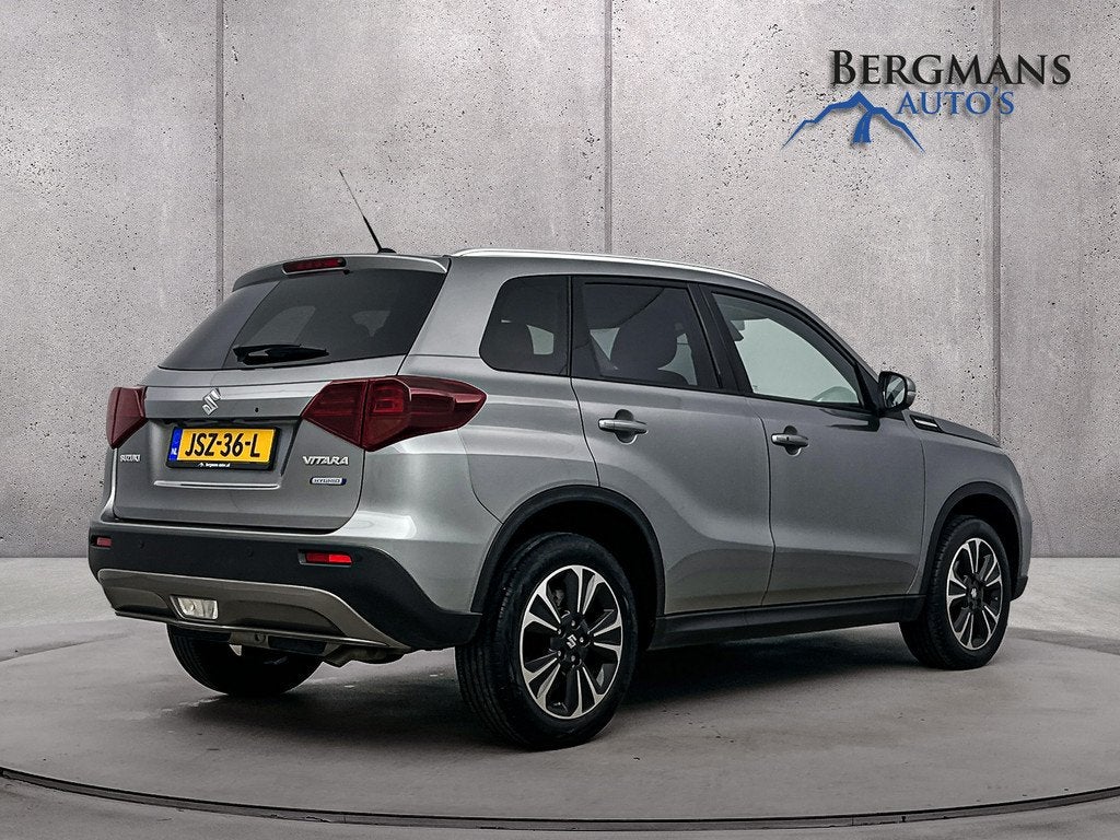 Suzuki Vitara 1.4 Boosterjet STYLE Smart Hybrid // STOELVERW, Auto's, Gebruikt, 4 cilinders, 129 pk, Leder en Stof