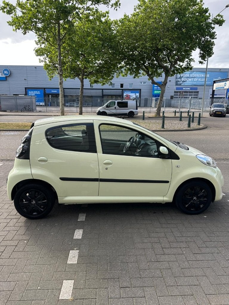 Citroën C1 1.0 5-DRS Sensodrive 2010 Geel, Auto's, Citroën, Stof, Zwart, 4 stoelen, C1