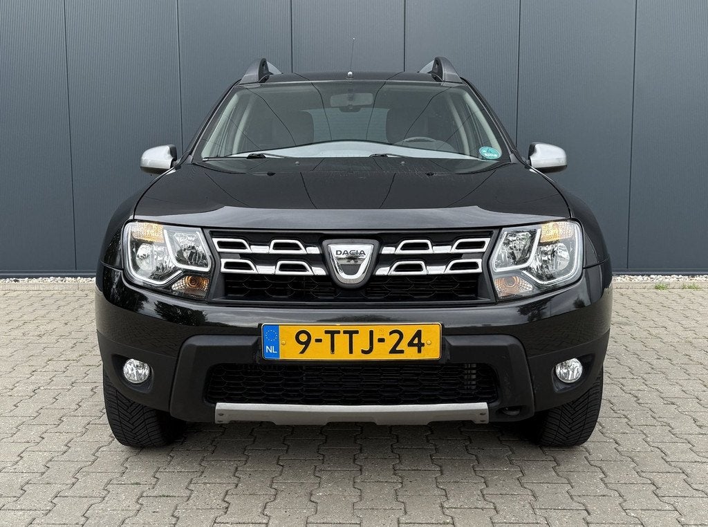 Dacia Duster 1.2 TCe 4x2 Prestige Airco Cruise Leder Navi Tr, Auto's, Dacia, Voorwielaandrijving, Euro 5, Gebruikt, Zwart
