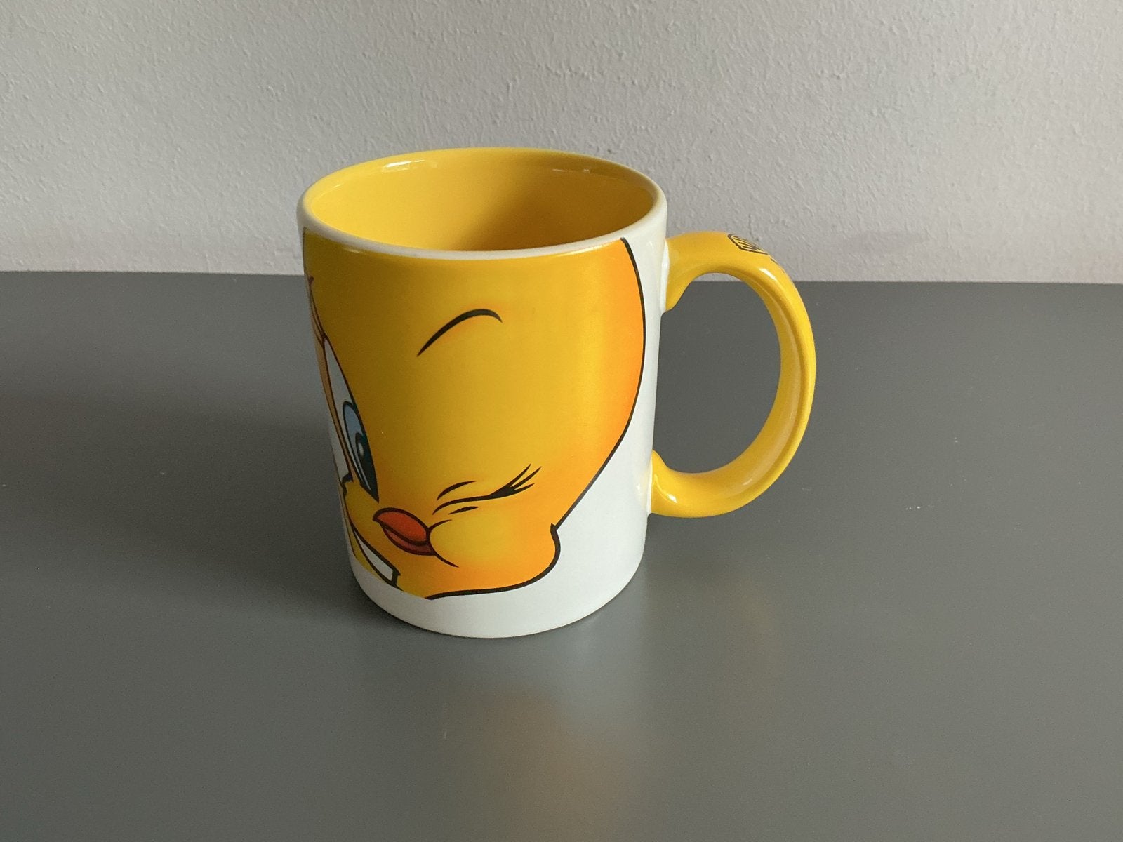 Mok Tweety Bird Movie World - Geel/Wit warner brothers nieuw, Gebruikt, Keramiek, Ophalen of Verzenden, Overige stijlen