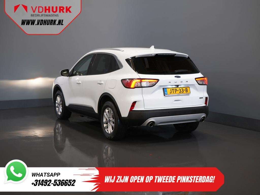Ford Kuga 2.5 PHEV 225 pk Titanium Stoelverw/ Stuurverw/ Nav, Auto's, Stof, Gebruikt, 4 cilinders, Wit