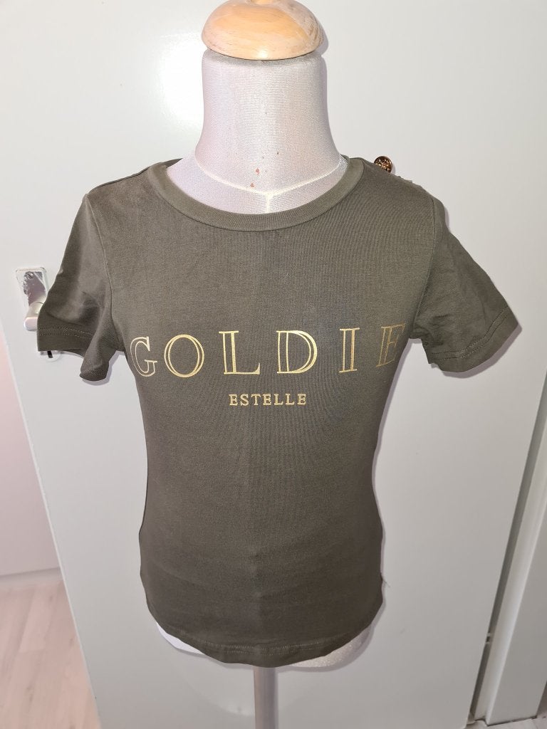 Goudkleurig T-shirt met 'GOLDIE ESTELLE' maat 134, Meisje, Ophalen of Verzenden, Zo goed als nieuw, Shirt of Longsleeve