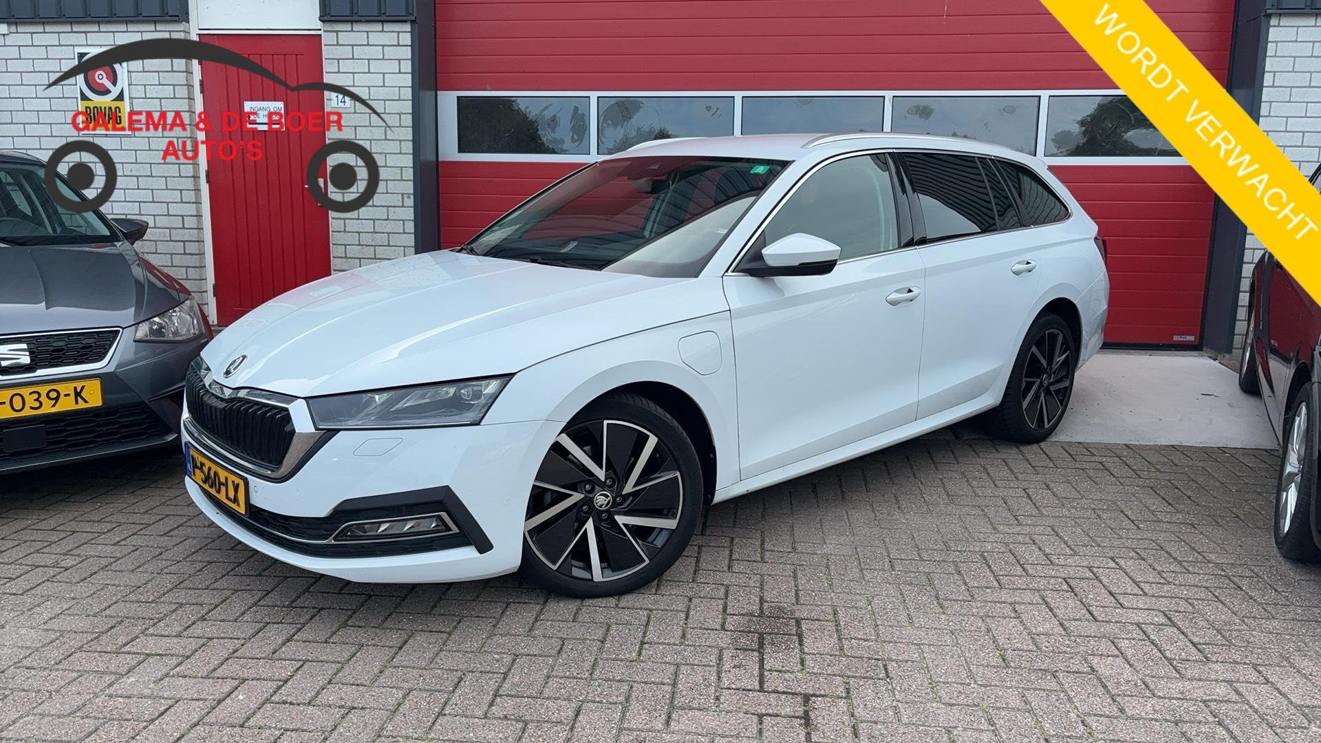 Skoda Octavia Combi 1.4 TSI iV PHEV Business Edition Plus SO, Auto's, Stof, Gebruikt, Euro 6, Wit
