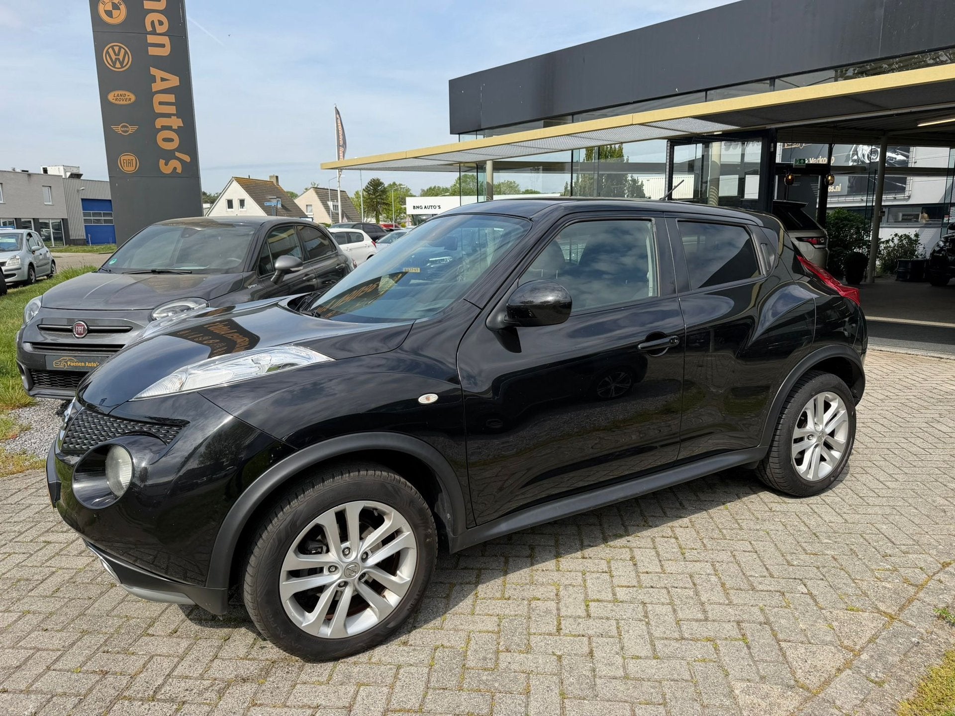 Nissan Juke 1.6 Tekna|Cam|T-haak|Leder, Auto's, Nissan, Euro 5, Zwart, 4 cilinders, Bedrijf