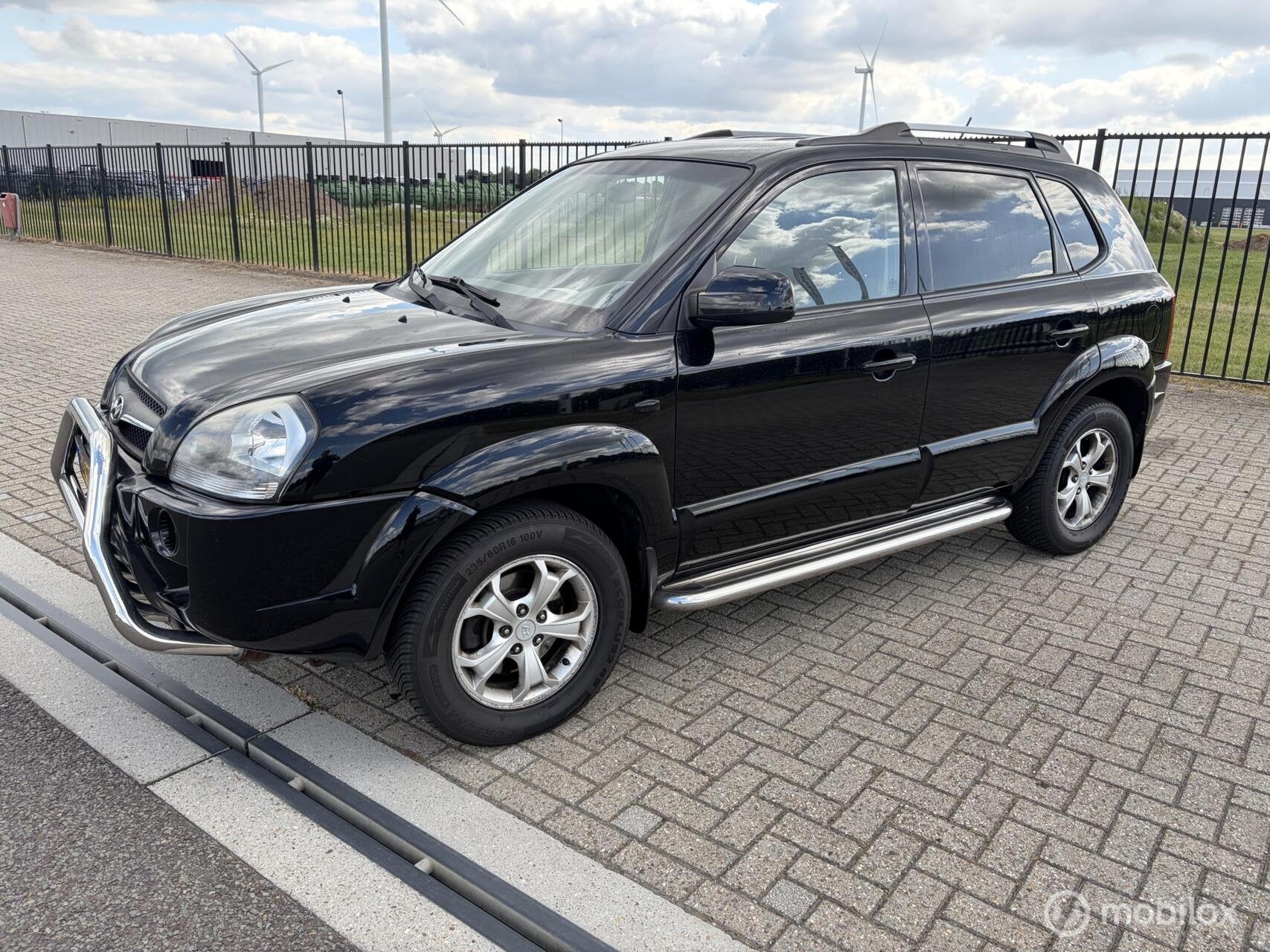 Hyundai Tucson 2.0i Style Cross, Auto's, 4 cilinders, Zwart, Origineel Nederlands, Handgeschakeld