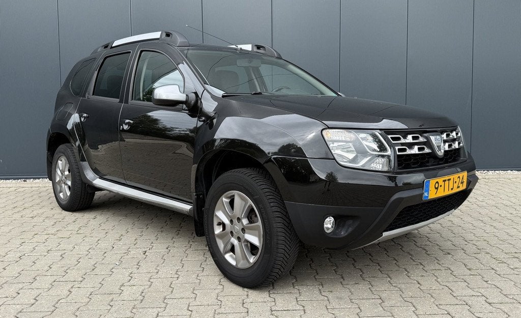 Dacia Duster 1.2 TCe 4x2 Prestige Airco Cruise Leder Navi Tr, Auto's, Dacia, Voorwielaandrijving, Euro 5, Gebruikt, Zwart