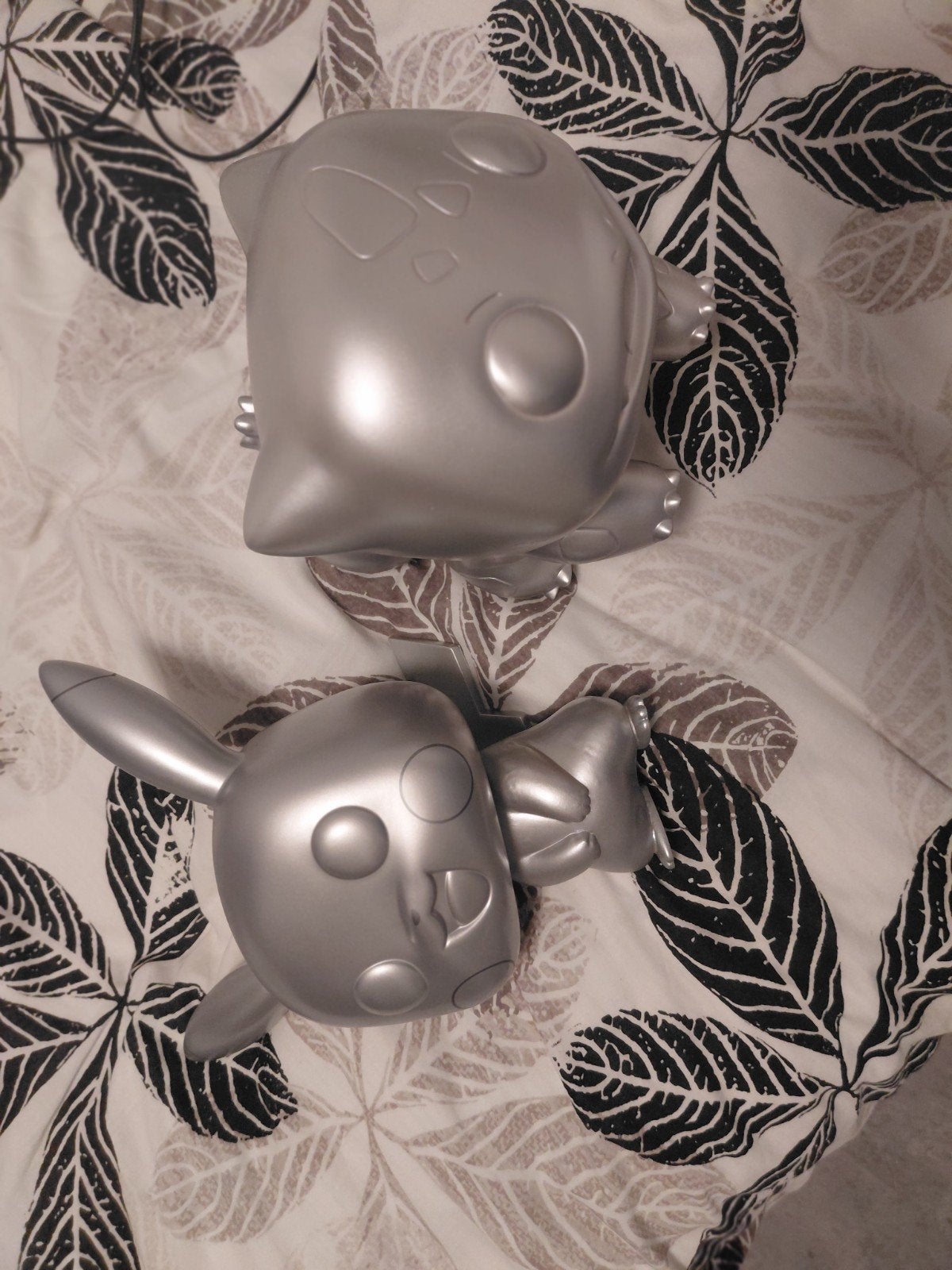 Zilveren Pokémon beeldjes: Pikachu en Bulbasaur, Ophalen