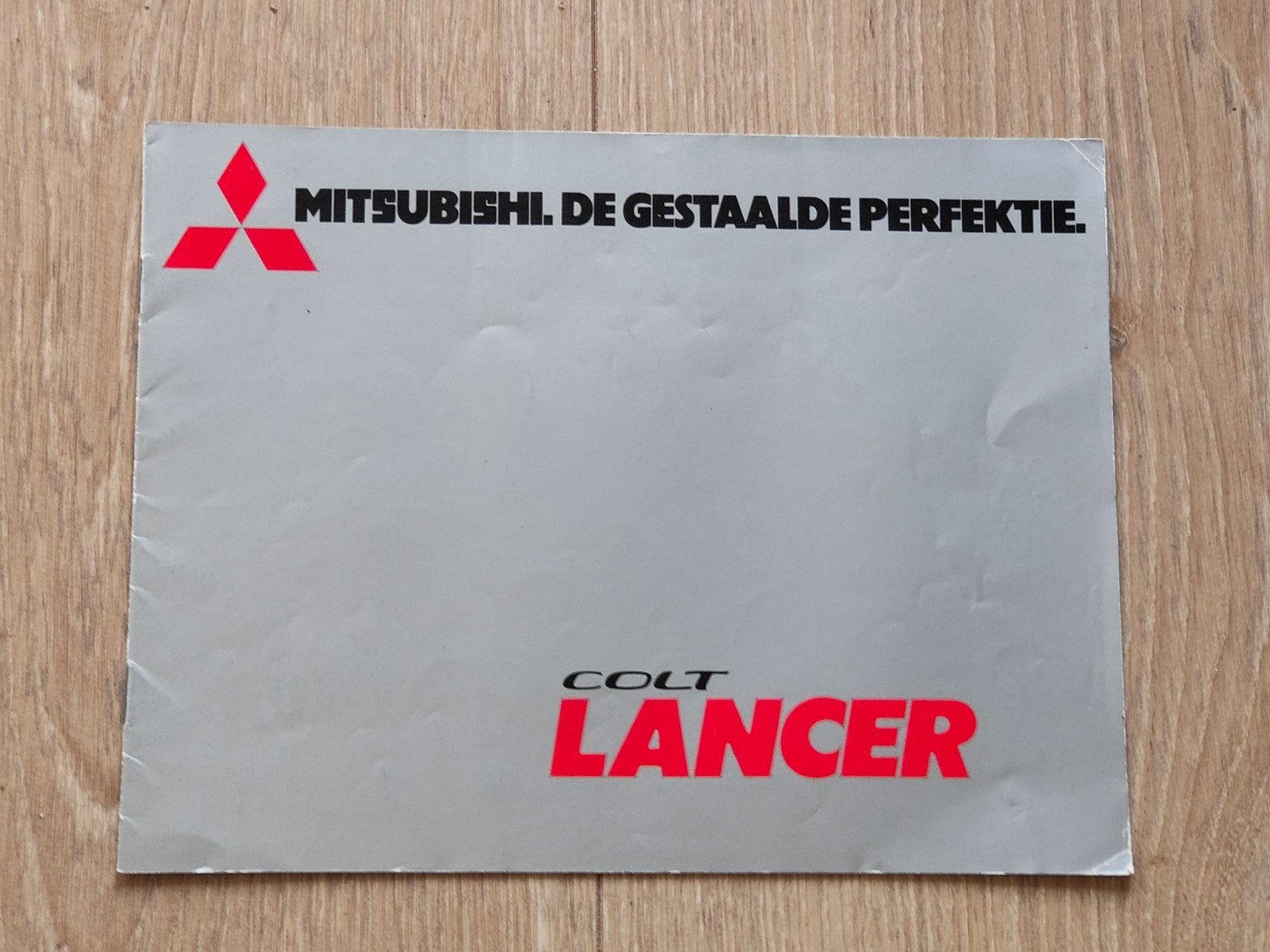 Autofolder Mitsubishi Colt Lancer, Ophalen of Verzenden, Zo goed als nieuw, Mitsubishi