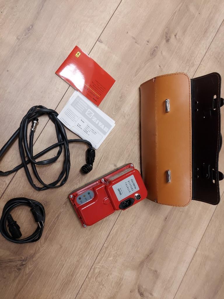 accu lader Ferrari in leren koffer origineel 500,--, Ophalen of Verzenden, Gebruikt, Ferrari