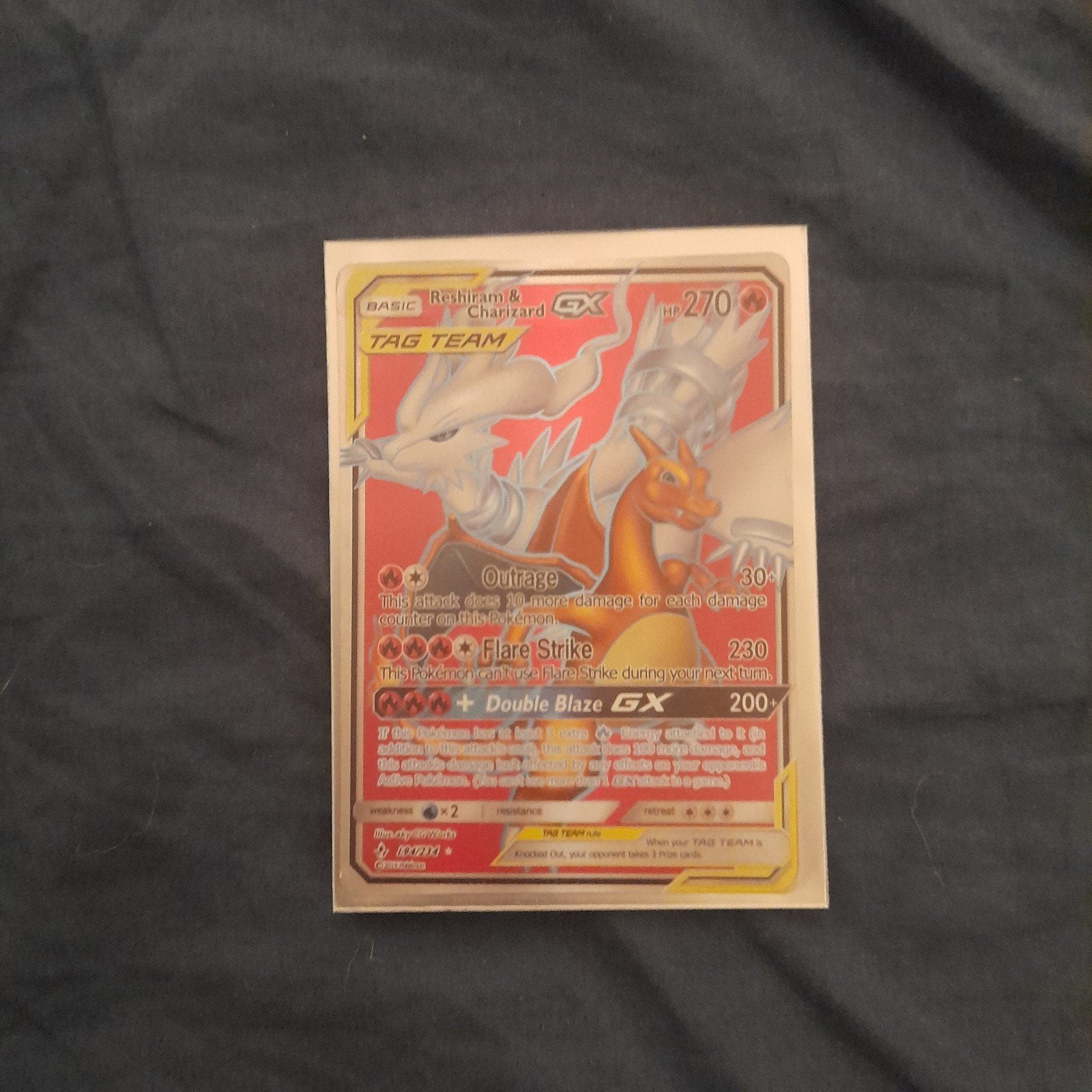 Reshiram & Charizard GX Pokémon Kaart - Tag Team, Ophalen of Verzenden, Zo goed als nieuw, Losse kaart, Foil