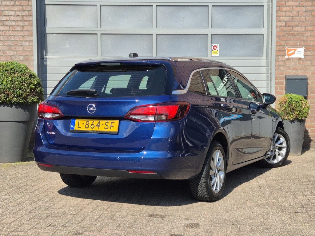 Opel Astra Sports Tourer 1.2 Business Elegance Dealer onderh, Gebruikt, Euro 6, 1199 cc, Blauw
