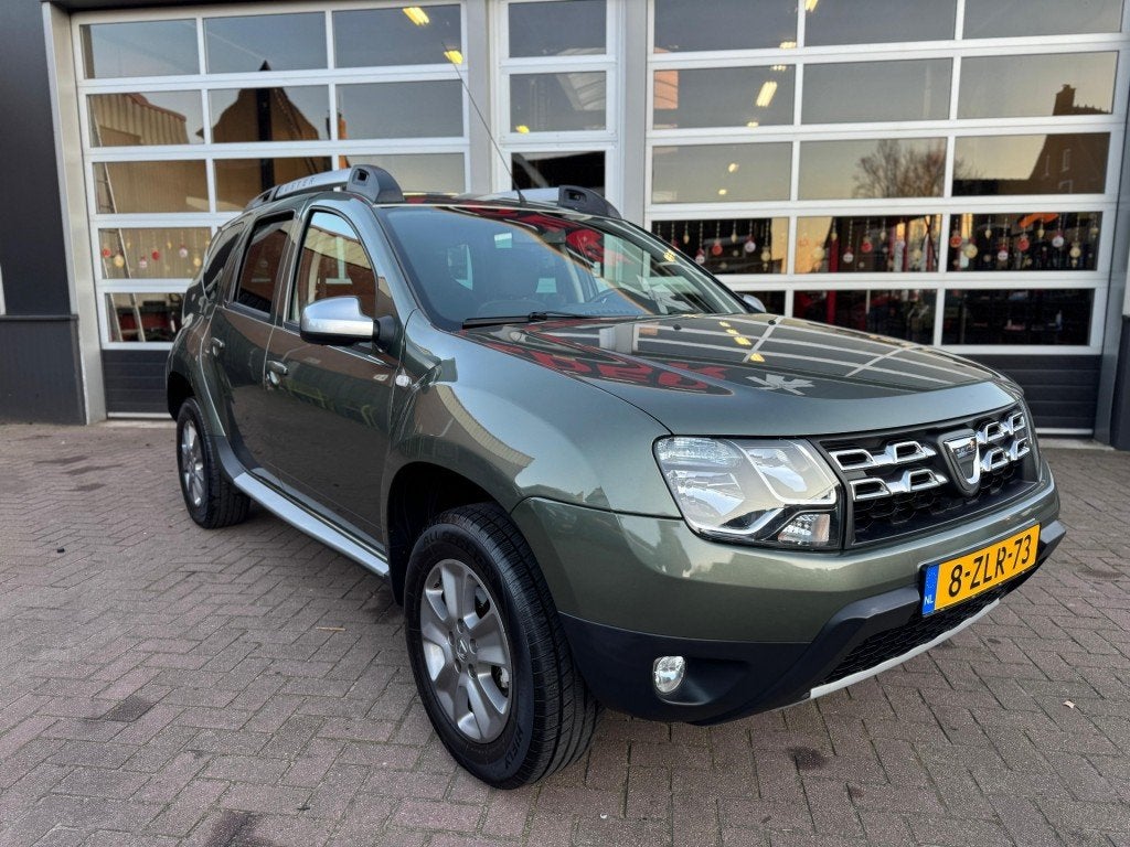 Dacia DUSTER  TCE 125 4X2 PRESTIGE / TREKHAAK / NAVI / CRUIS, Auto's, Dacia, Voorwielaandrijving, Euro 5, 125 pk, Gebruikt