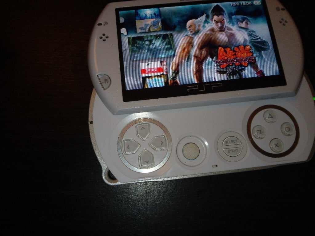 PSP Go met oplader, Ophalen, Met games, Wit, Zo goed als nieuw