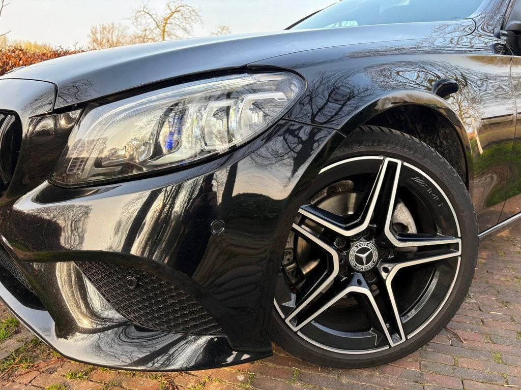 Mercedes-Benz C-klasse Estate 180 AMG/CARPLAY/NAVI/CRUIS/VOL, Automaat, Leder en Stof, Zwart, 14 km/l