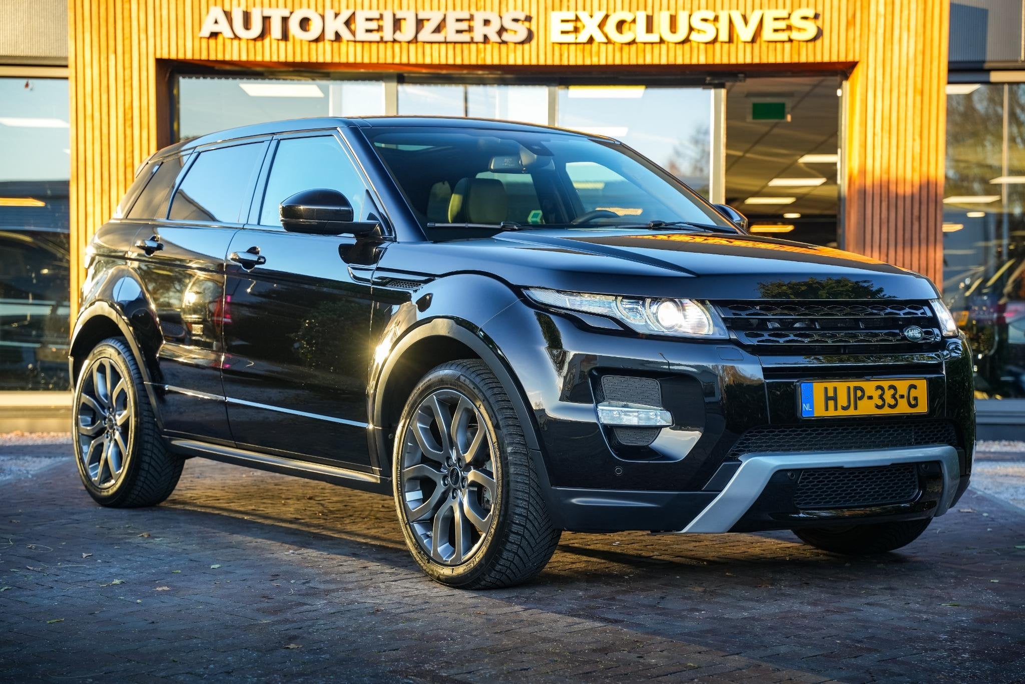 Land Rover Range Rover Evoque 2.0 Si 4WD Prestige Dynamic St, Auto's, Euro 5, 4 cilinders, Zwart, Leder