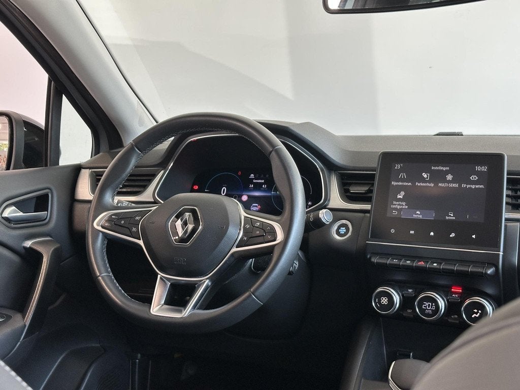Renault Captur 1.6 E-Tech Plug-in Hybrid 160 Business TREKHA, Gebruikt, 4 cilinders, Met garantie (alle), Leder en Stof