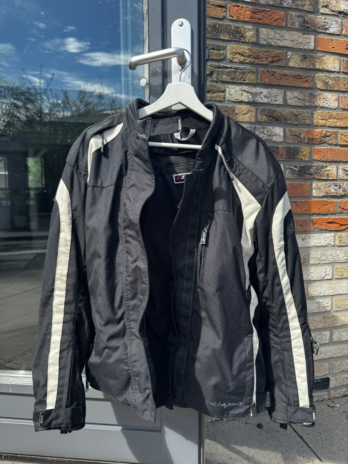 Zwarte motorjas voor dames - Maat 42 (L), Motoren, Kleding | Motorkleding, Ophalen of Verzenden