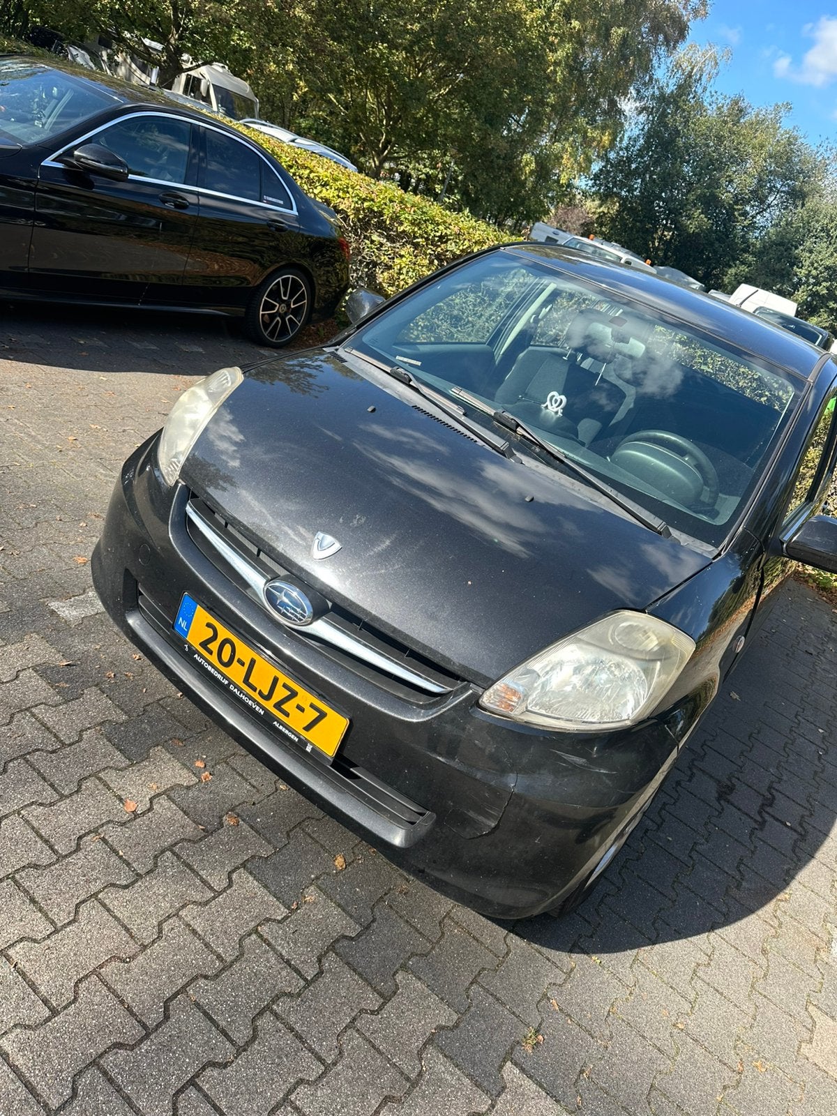 Subaru Justy 1.0 2010 Zwart, Auto's, Voorwielaandrijving, Justy, Stof, Zwart