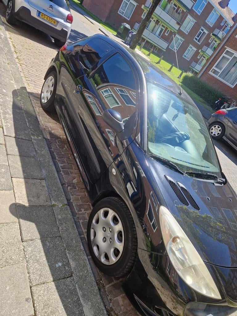 Peugeot 206+ 1.4 3D 2010 Zwart, Auto's, Peugeot, Voorwielaandrijving, Stof, 4 cilinders, Zwart