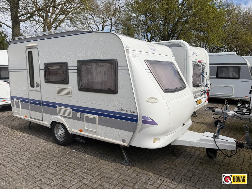 Hobby De Luxe 400 SF Mover/Voortent/Fietsdr., Caravans en Kamperen, Caravans, Hobby, Bedrijf, Treinzit, Tot en met 4