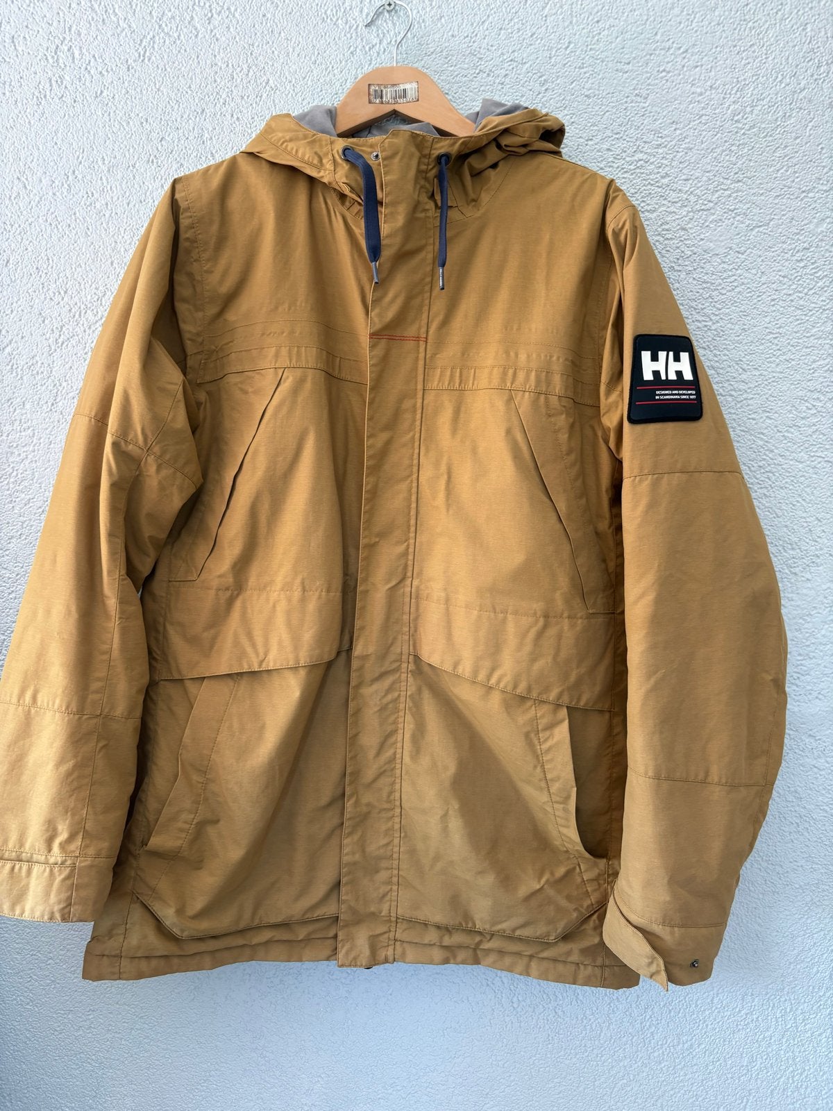 Helly Hansen winterjas maat L., Ophalen of Verzenden, Gedragen, Maat 52/54 (L), Bruin