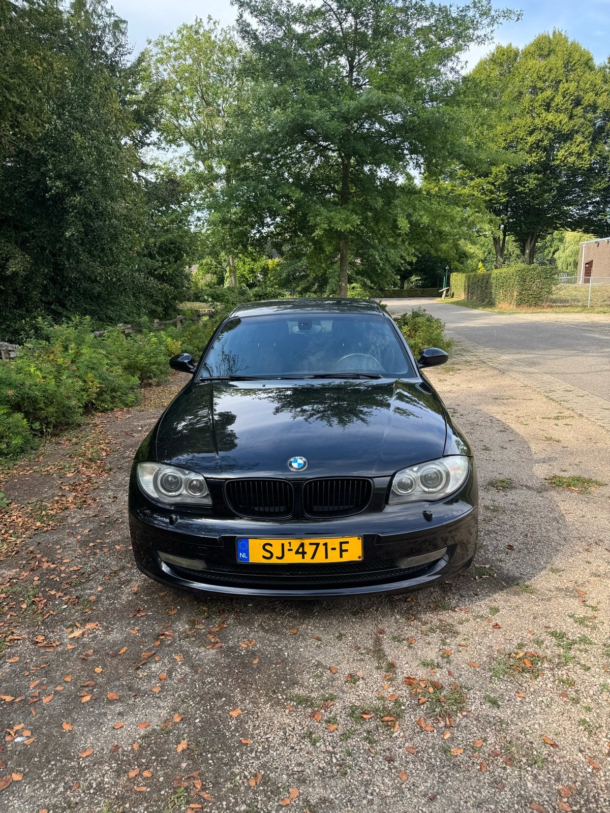 BMW 1-Serie 2.0 118I 5DR AUT 2009 Zwart, Auto's, Achterwielaandrijving, 1995 cc, Zwart, 1200 kg