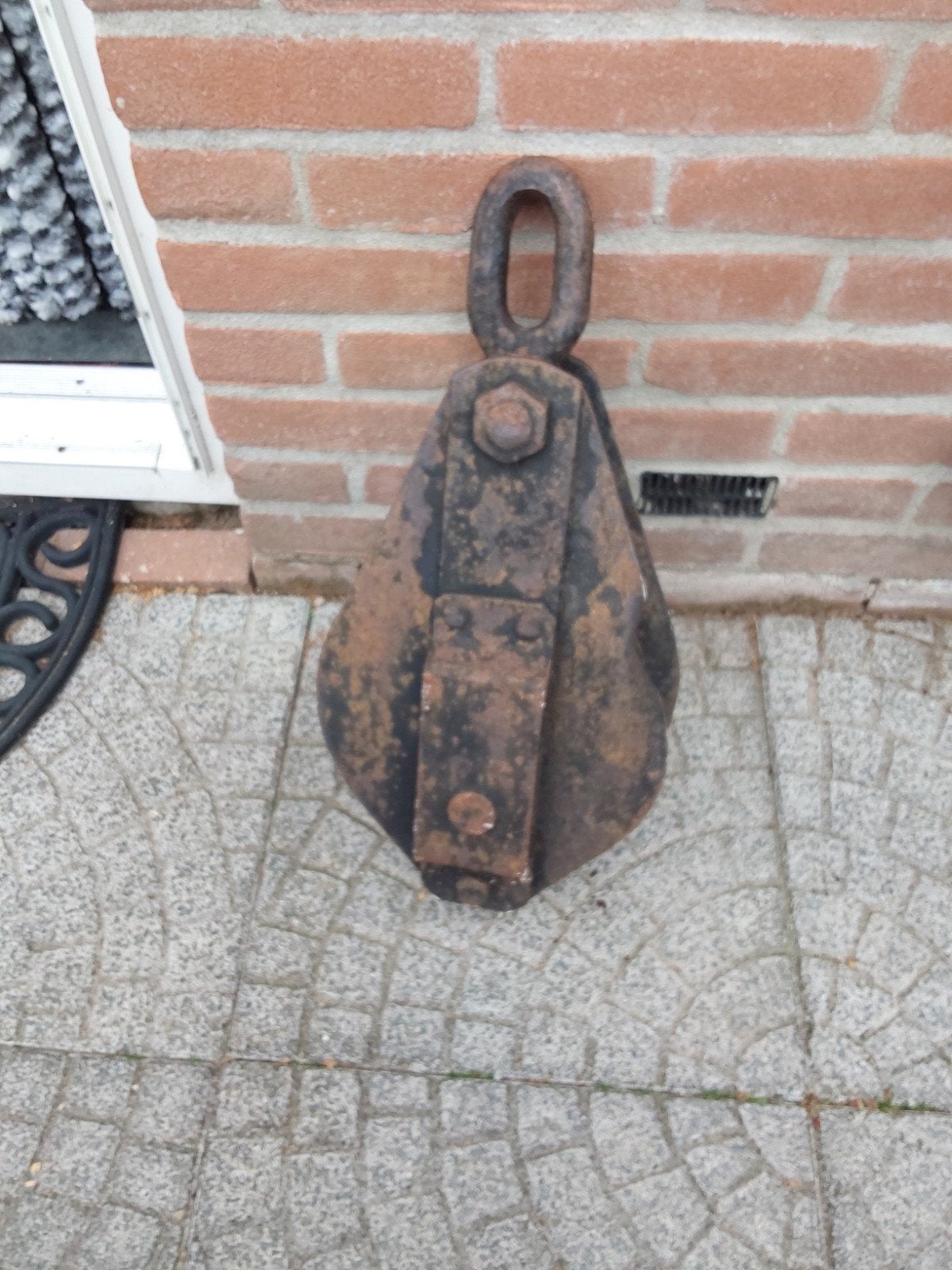 grote zware gietijzeren katrol, Ophalen