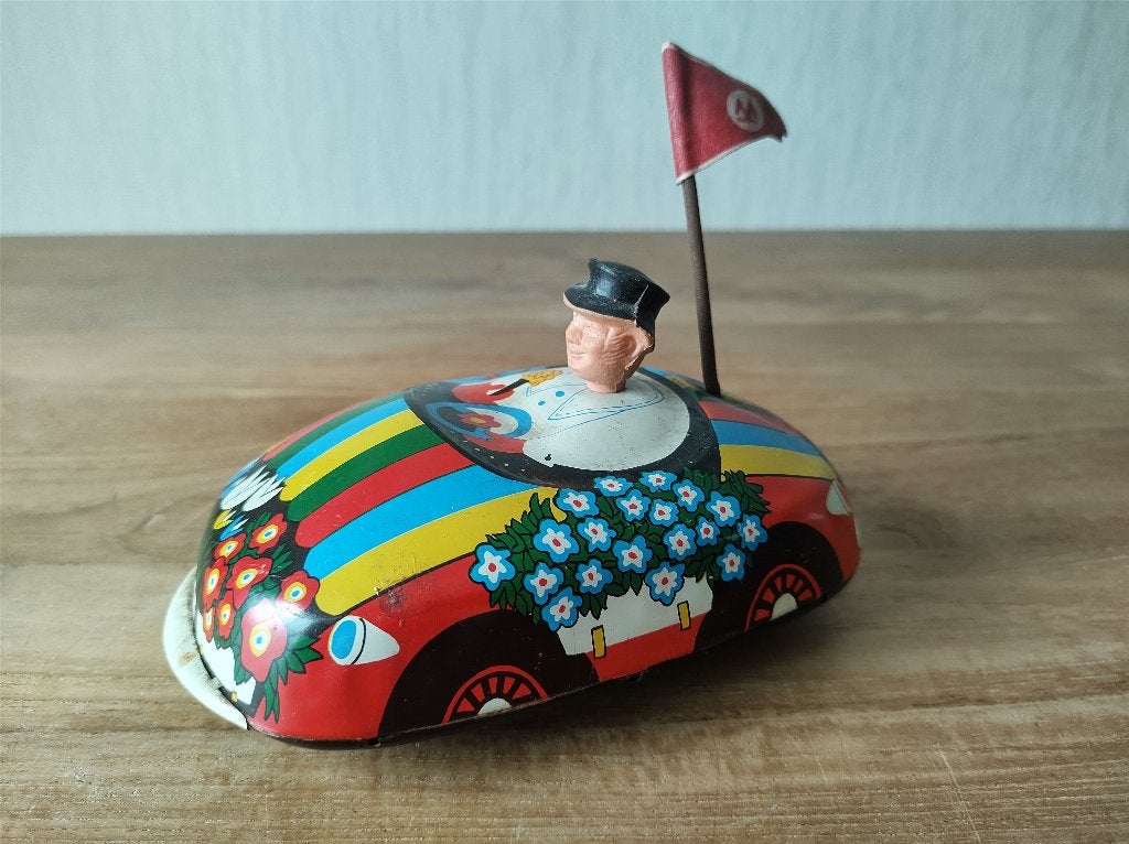Oud blikken opwind speelgoed bloemen auto made in GDR, Ophalen of Verzenden