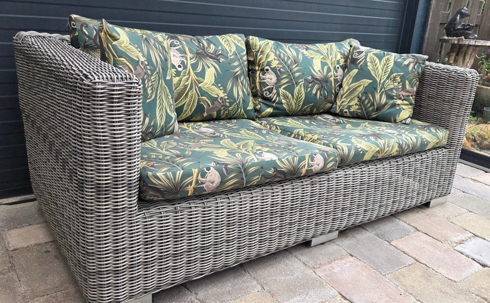 Rotan tuinbank 165x84 met jungle print kussens, Ophalen, Gebruikt, Bank