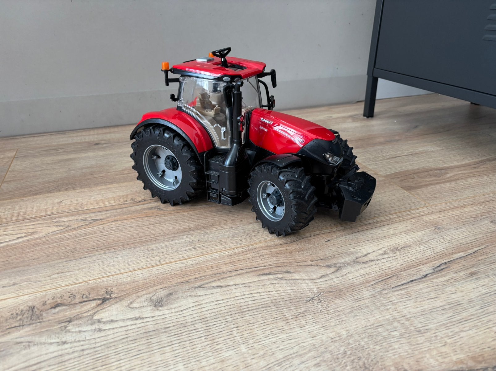 Case Optum 300 Bruder, Ophalen, Zo goed als nieuw