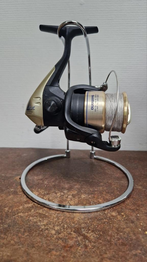 Zgan Shimano AX 2500FB met gevlochten Lijn., Ophalen of Verzenden, Zo goed als nieuw, Molen