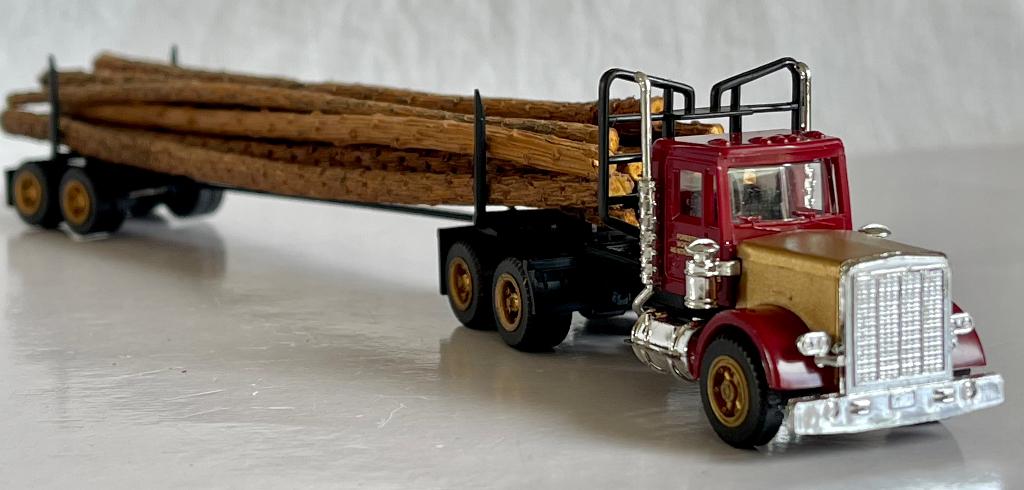 Herpa 856270: Peterbilt houttransporter, Ophalen of Verzenden, Zo goed als nieuw, Bus of Vrachtwagen, Herpa