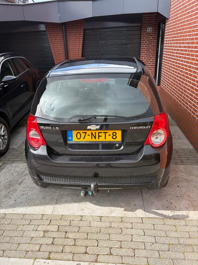 Chevrolet Aveo 1.2 16V 5D 62KW 2010 Zwart, Auto's, Chevrolet, Voorwielaandrijving, 40 €/maand, Aveo, 4 cilinders