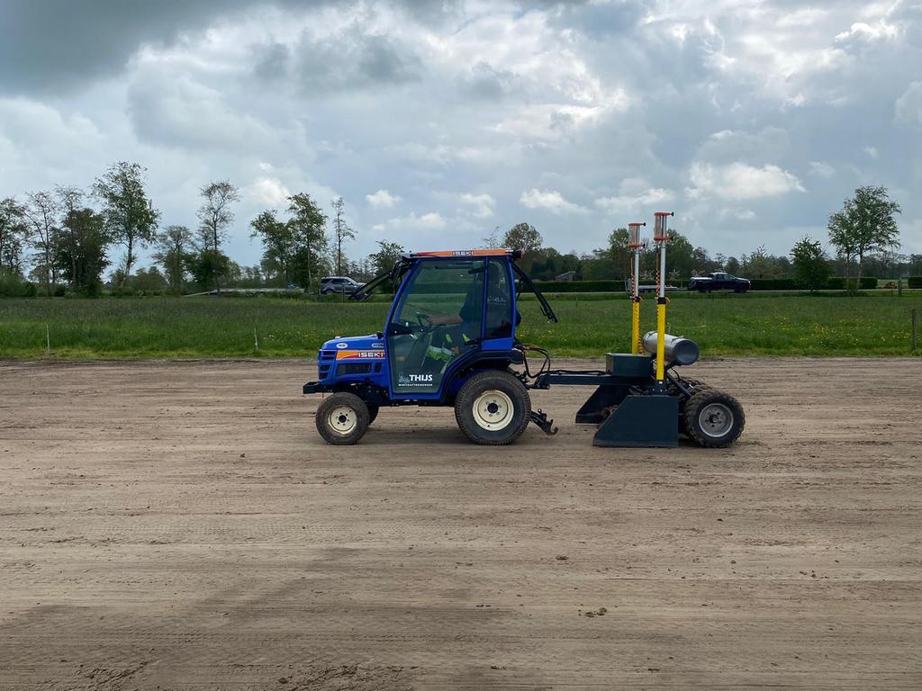 Manegebodem paardenbak drainage egaliseren