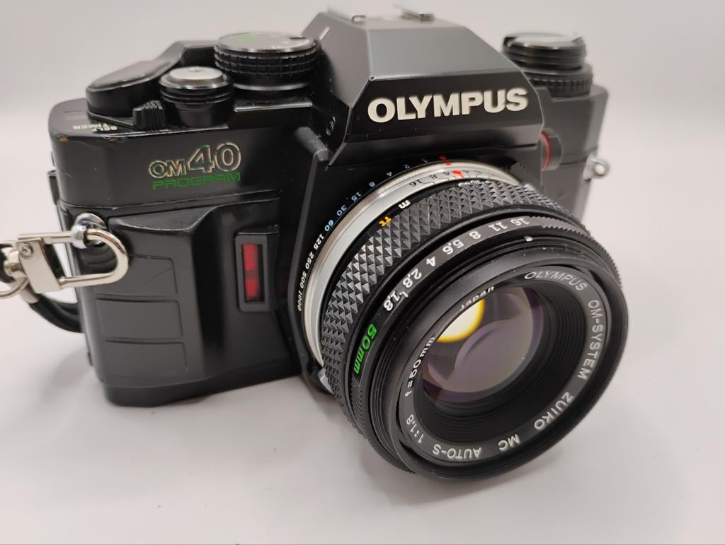 Olympus OM-40 met Zuiko  f1.8 50mm lens en T32 flash., Audio, Tv en Foto, Fotocamera's Analoog, Ophalen, Spiegelreflex, Olympus