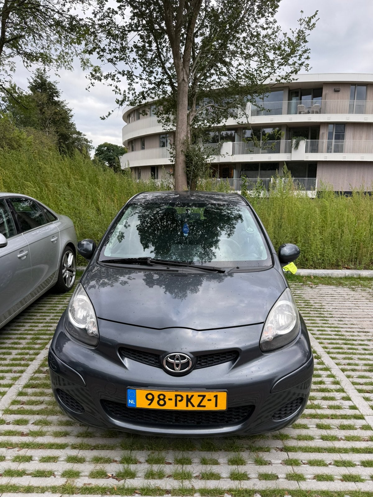 Toyota Aygo 1.0 12V Vvt-i 5DRS 2011 Grijs, Auto's, Voorwielaandrijving, 4 stoelen, 68 pk, Origineel Nederlands
