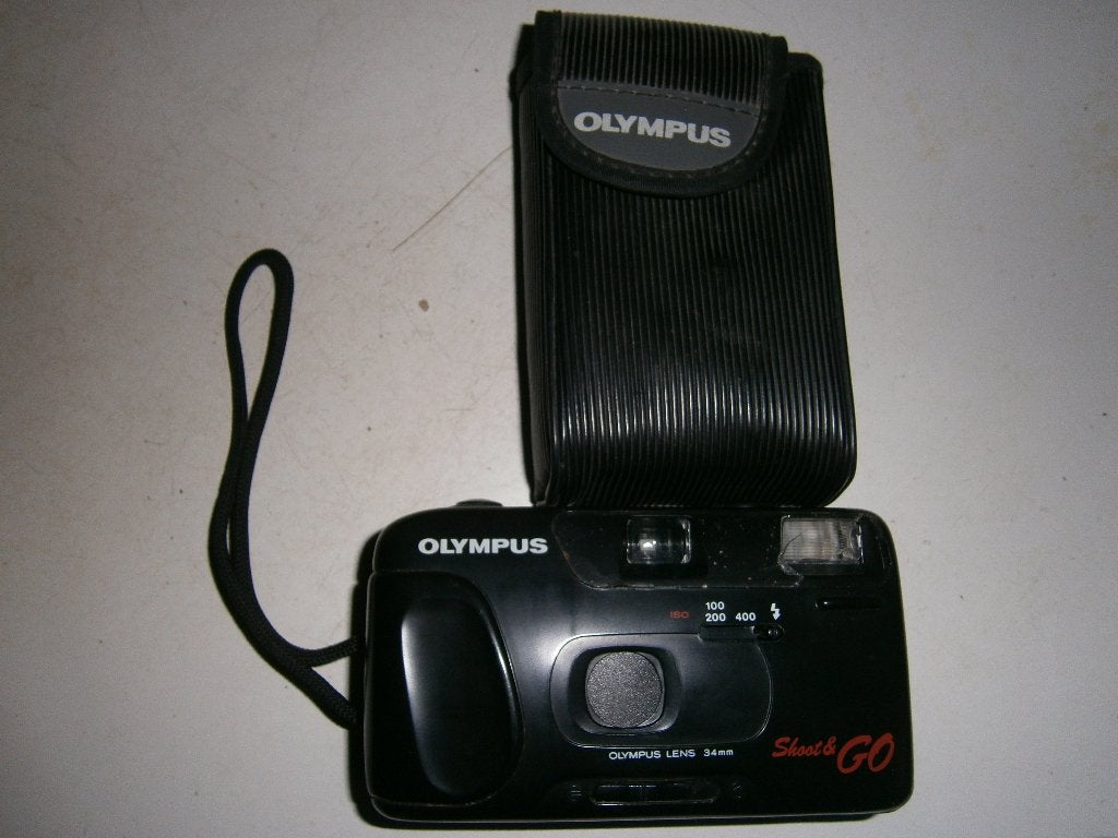 Olympus Shoot & Go analoog fototoestel + hoes en lus. Schade, Audio, Tv en Foto, Fotocamera's Analoog, Ophalen, Niet werkend, Compact